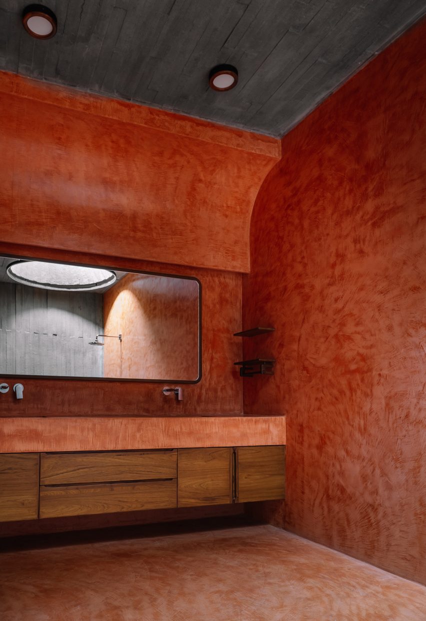 Bathroom with red walls and double sink vanity