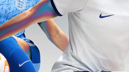 Two kits featuring blue shorts for the England women's football team