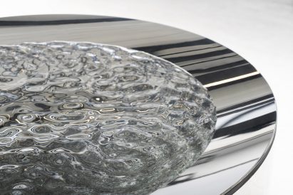 Ripping water in a stainless steel basin by Lachlan Turczan