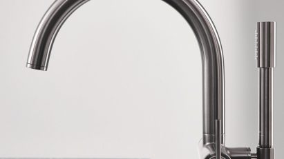 Curved tap with shower wand attachment