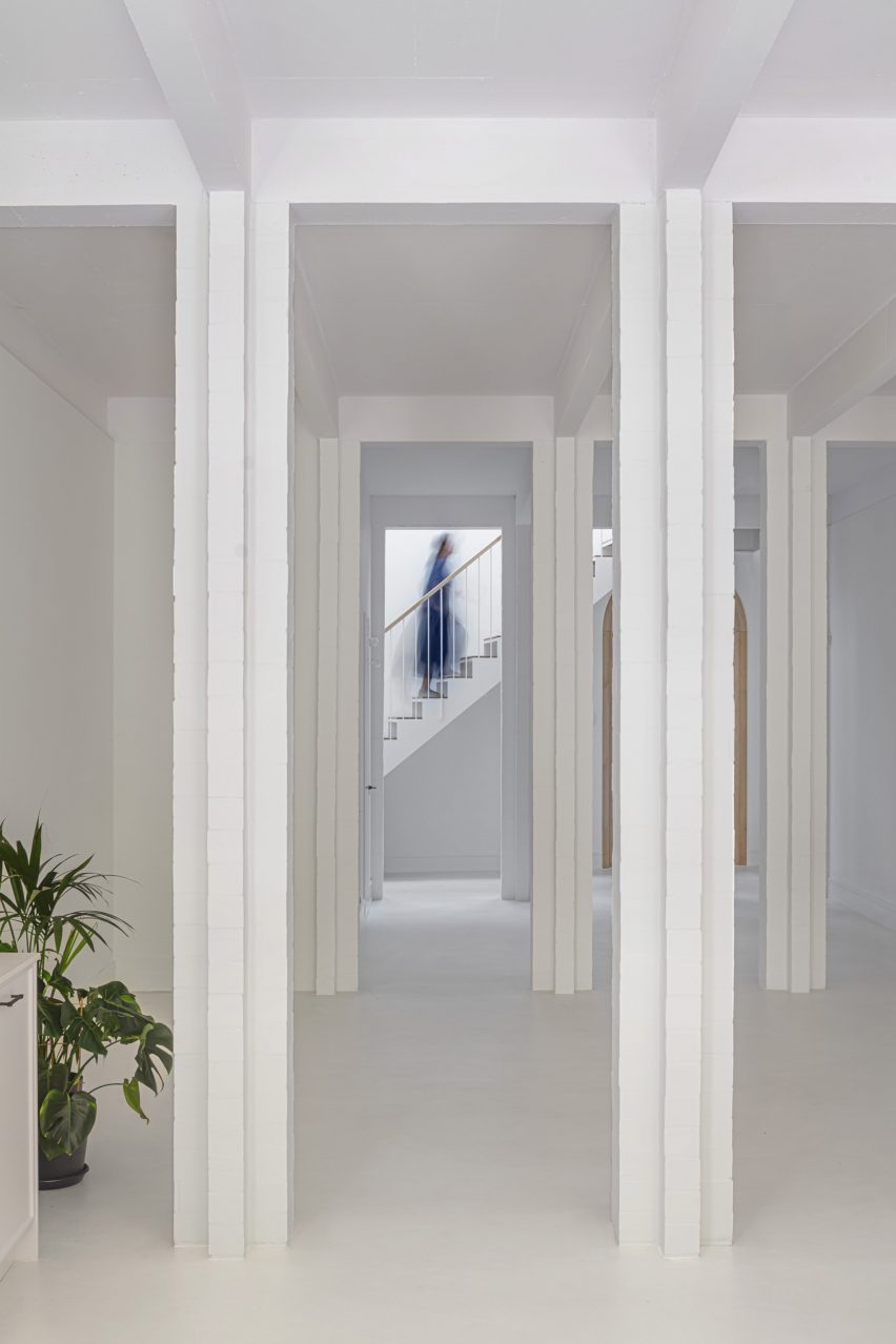 Interior with white walls, floors and square columns