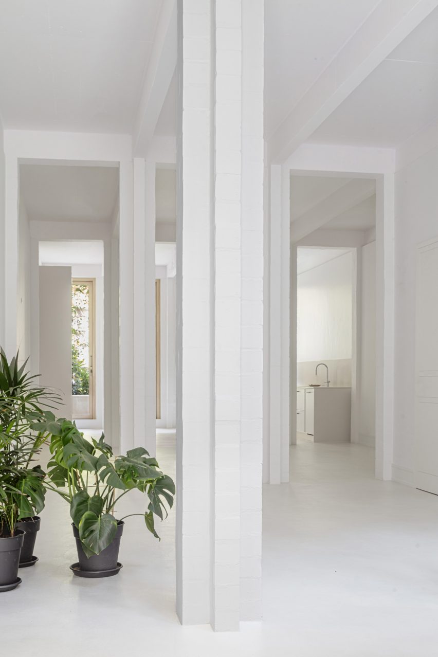 Interior with white walls, floors and square columns