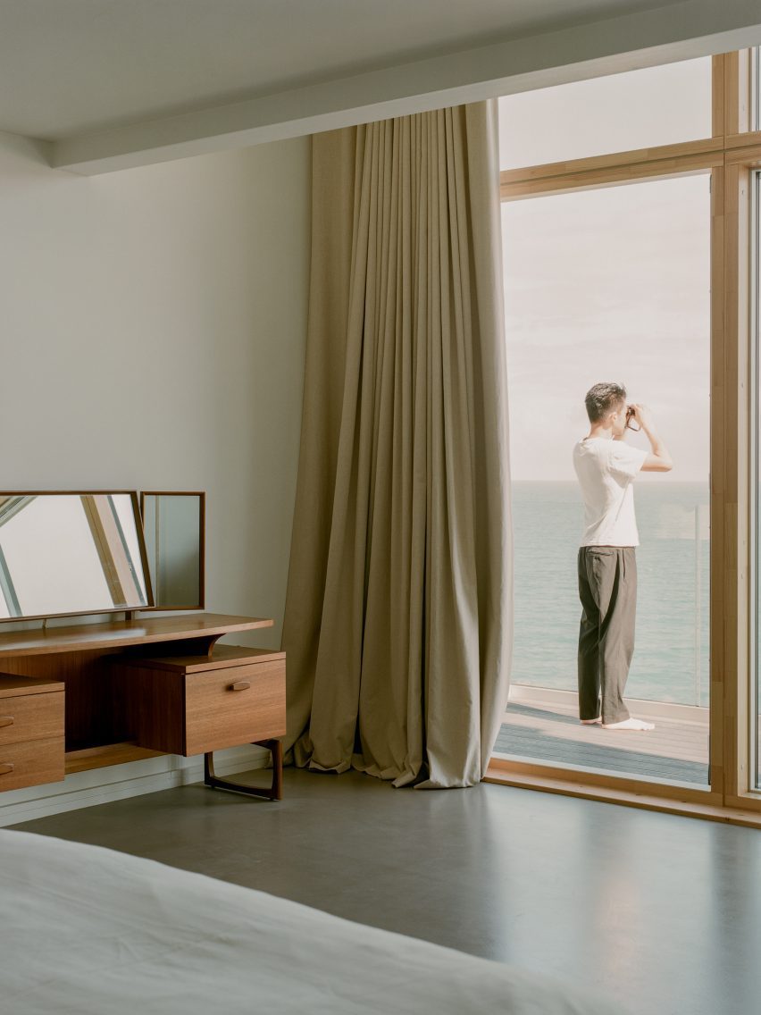 Minimalist bedroom inside House by the Sea by Of Architecture