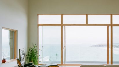 Minimalist living room inside House by the Sea by Of Architecture