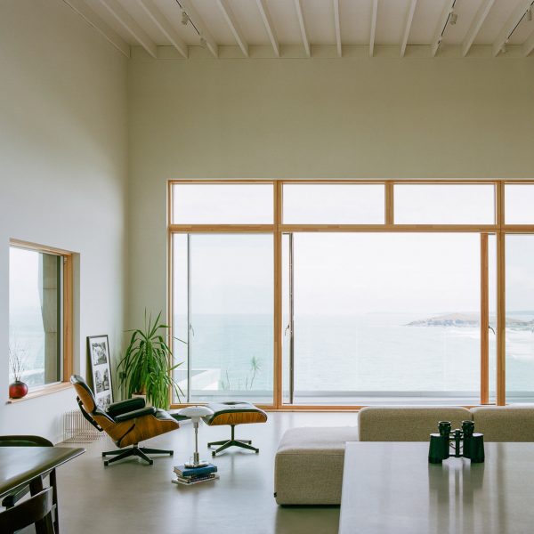 Minimalist living room inside House by the Sea by Of Architecture