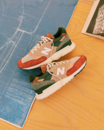 Shoes on table with architectural plans in the background