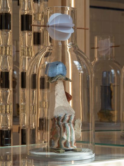 Ceramics by Natascia Fenoglio under a glass bell jar