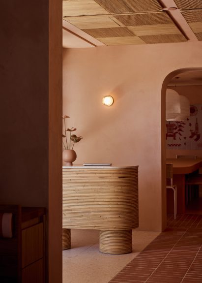 Wooden reception desk of Byron Bay restaurant by Studio Plenty