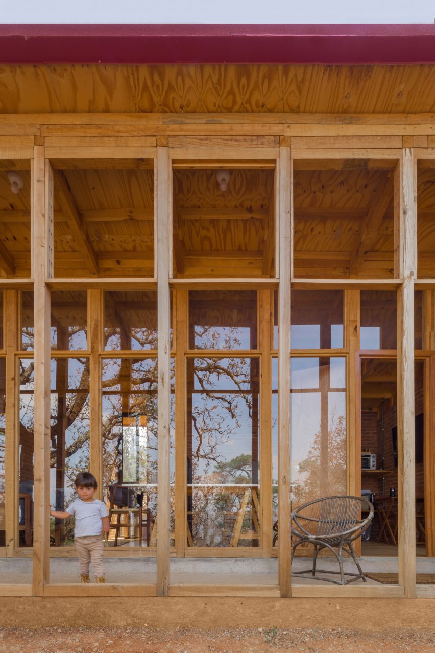 Porch with a wooden structure in front of a one-storey home
