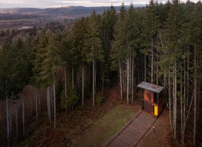 Aerial view of studio with mountainous terrain in background