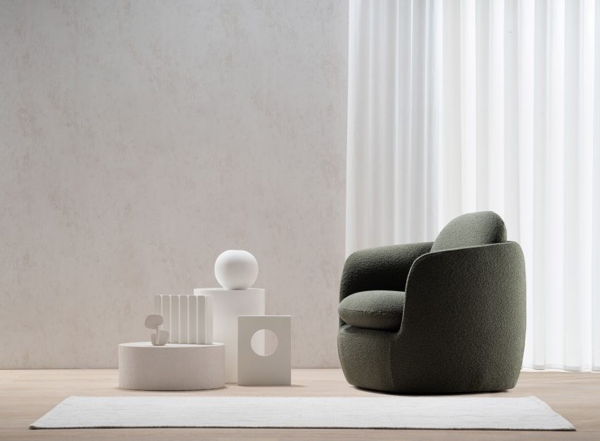 Grey-green chair in light room