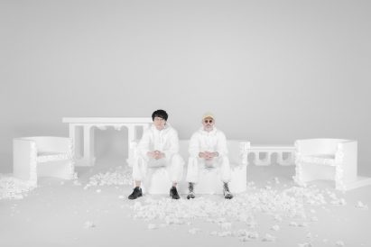 Oki Sato and Daniel Arsham sat on styrofoam bench at Break to Make installation