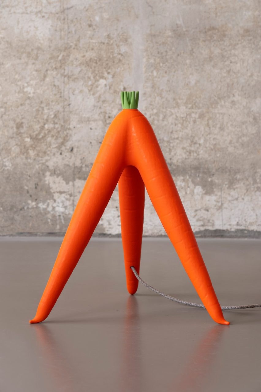 Tripod carrot lamp in the OMG-GMO collection by Robert Stadler