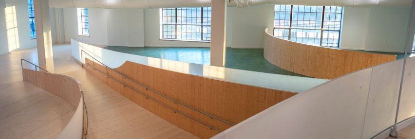 Interior of the Bronx Children's Museum with wood ramp