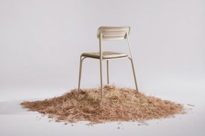 Rear view of PEEL chair by Prowl Studio on a bed of woodchips