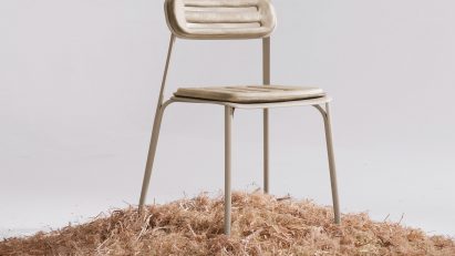 Frontal view of PEEL chair by Prowl Studio on a bed of woodchips