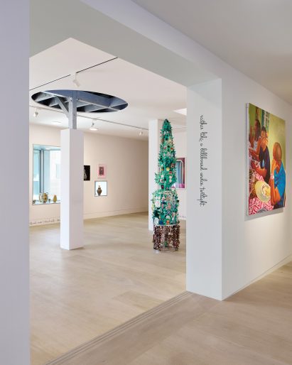 View from Showroom B to Showroom A, showing a curved cutout in the ceiling
