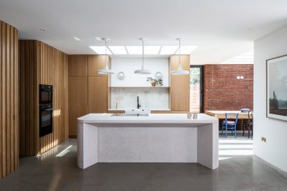Wooden kitchen with concrete island