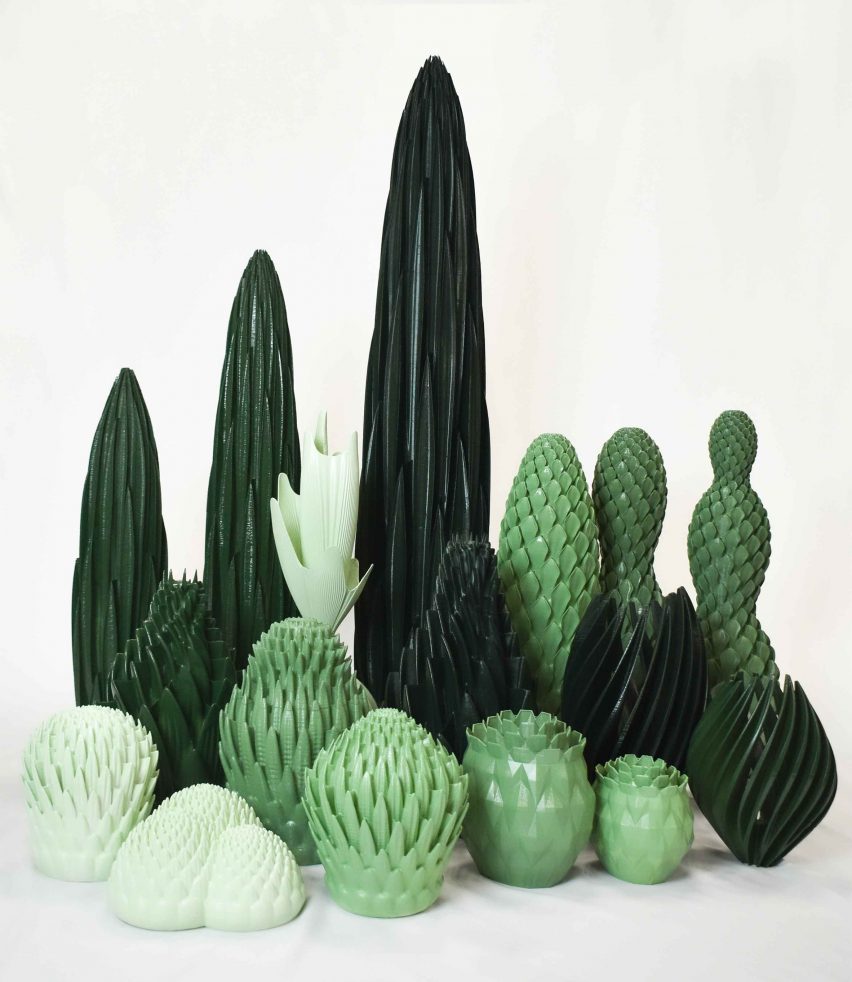 Photo of an arrangement of sculptural green objects in different shapes with complex geometries resembling plants