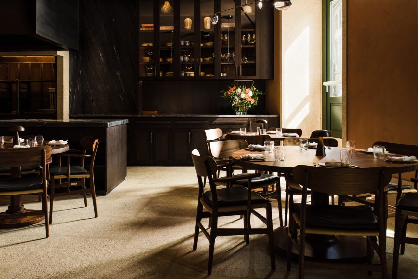 Green door and wooden table in Porto restaurant
