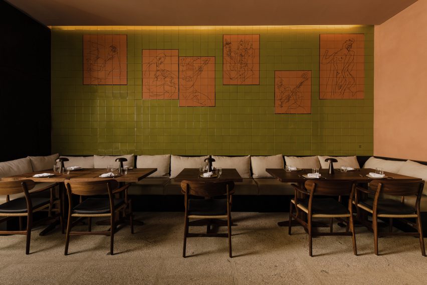 Green and orange tiled mural in interior by Space Copenhagen