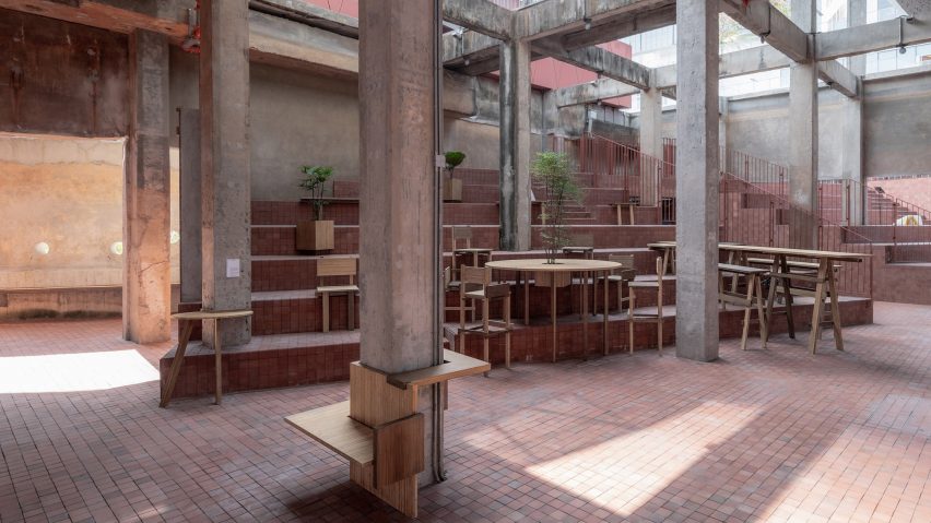 Courtyard area with steps and wooden furniture