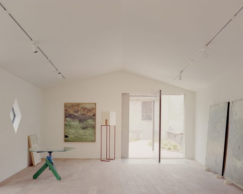 Interior of Threshold and Treasure art gallery in Italy by AMAA