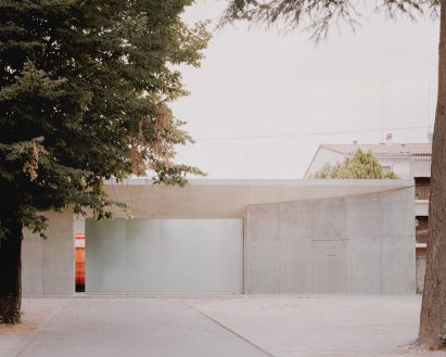 Concrete entrance to the Threshold and Treasure art gallery in Italy by AMAA