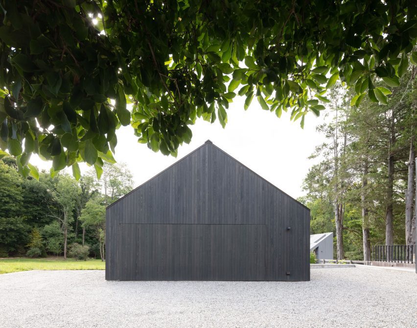 Gable end of a black timber barn-style home