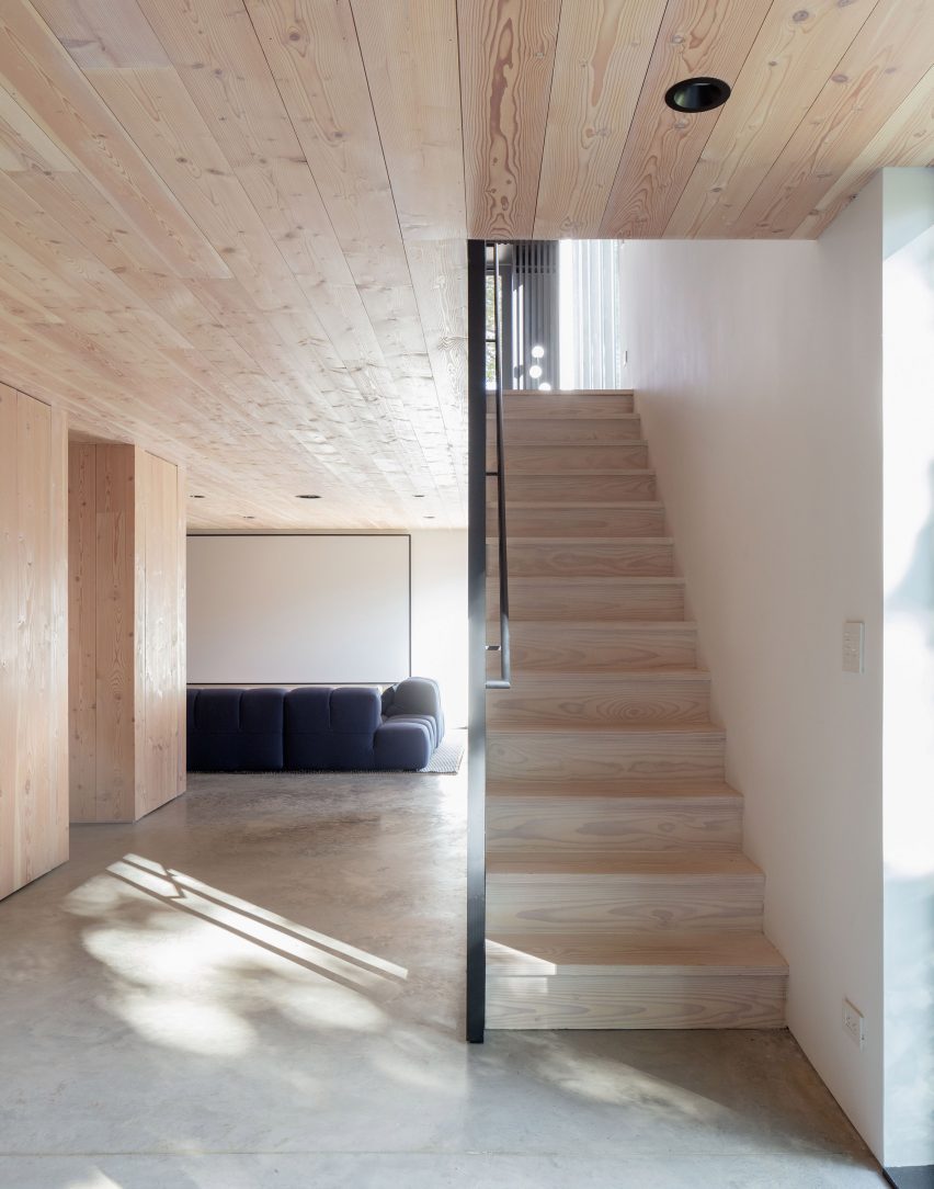 Interior wooden staircase at the New York farmhouse by Worrell Yeung