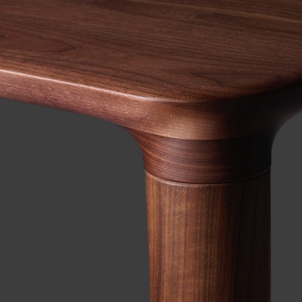Photo of the corner of a wooden table by Koyori