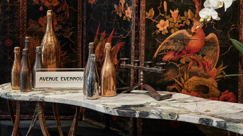 Photo of bottles of wine on a marble table
