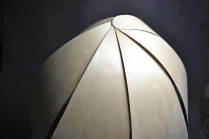 A close-up render of a silver acoustic dome