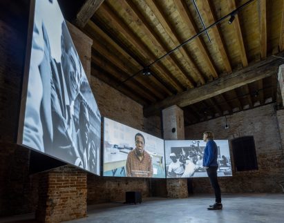 Person watching tropical modernism film