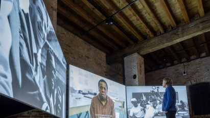 Man watching film at Applied Arts Pavilion