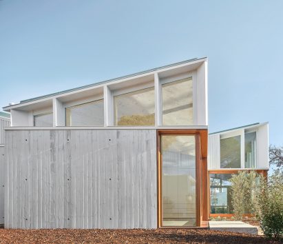 A cluster of mono-pitched square structures comprising House 016 by Arquitecturia