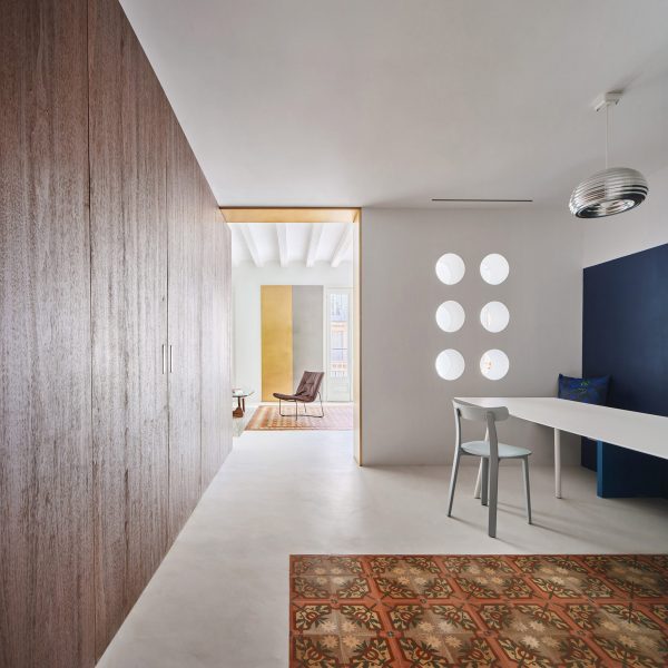 Girona Street apartment designed by Raúl Sanchez Architects features walnut wood wall