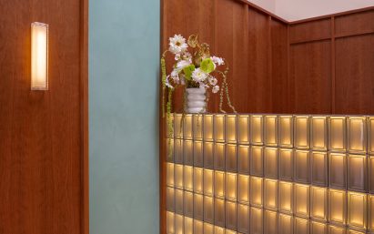 Glass block counter abutting walnut panelling