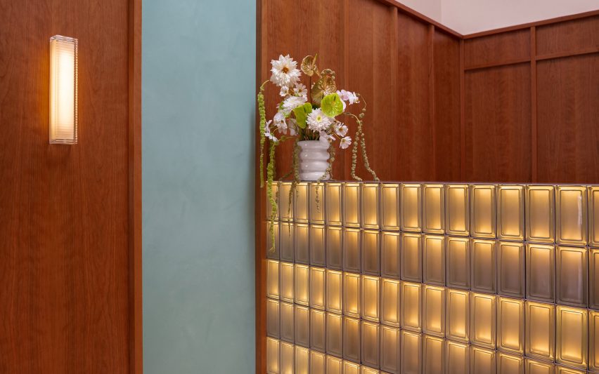 Glass block counter abutting walnut panelling