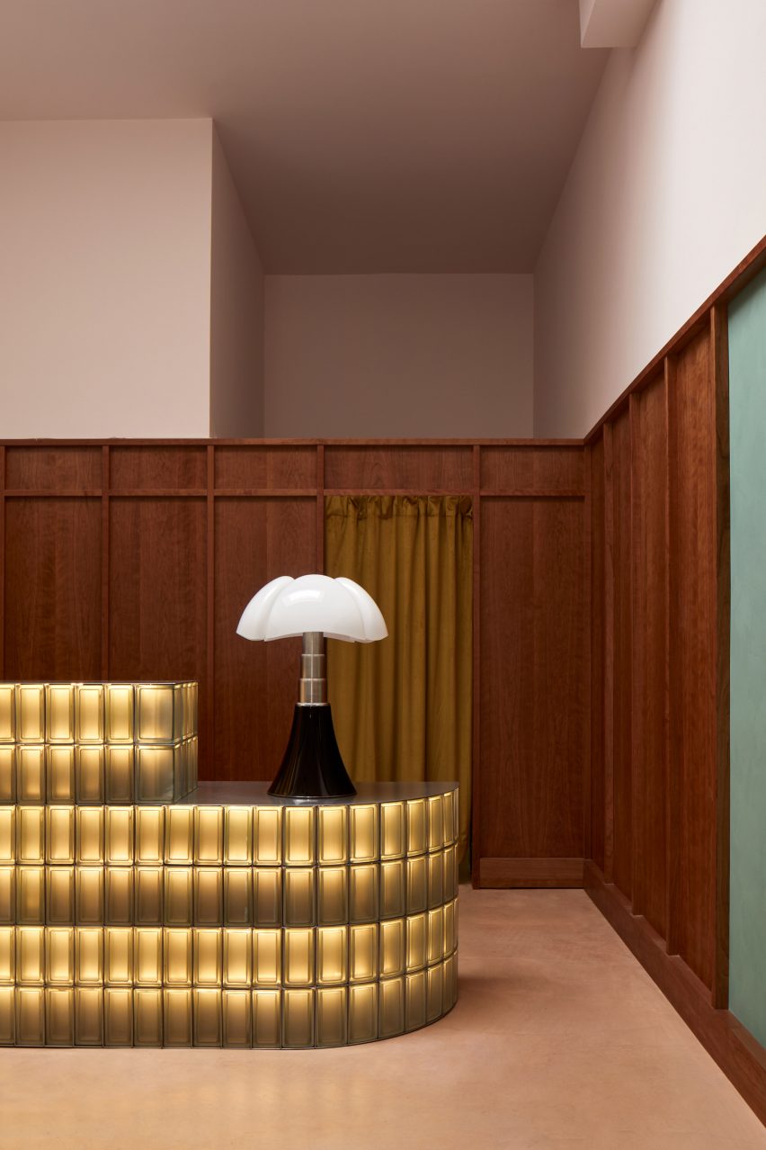 Glowing glass block counter with Gae Aulenti lamp