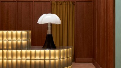 Glowing glass block counter with Gae Aulenti lamp