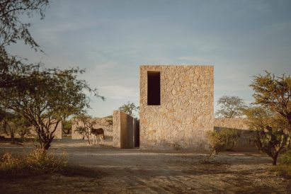 Rectilinear volumes clad in locally quarried stone in San Miguel de Allende, Mexico