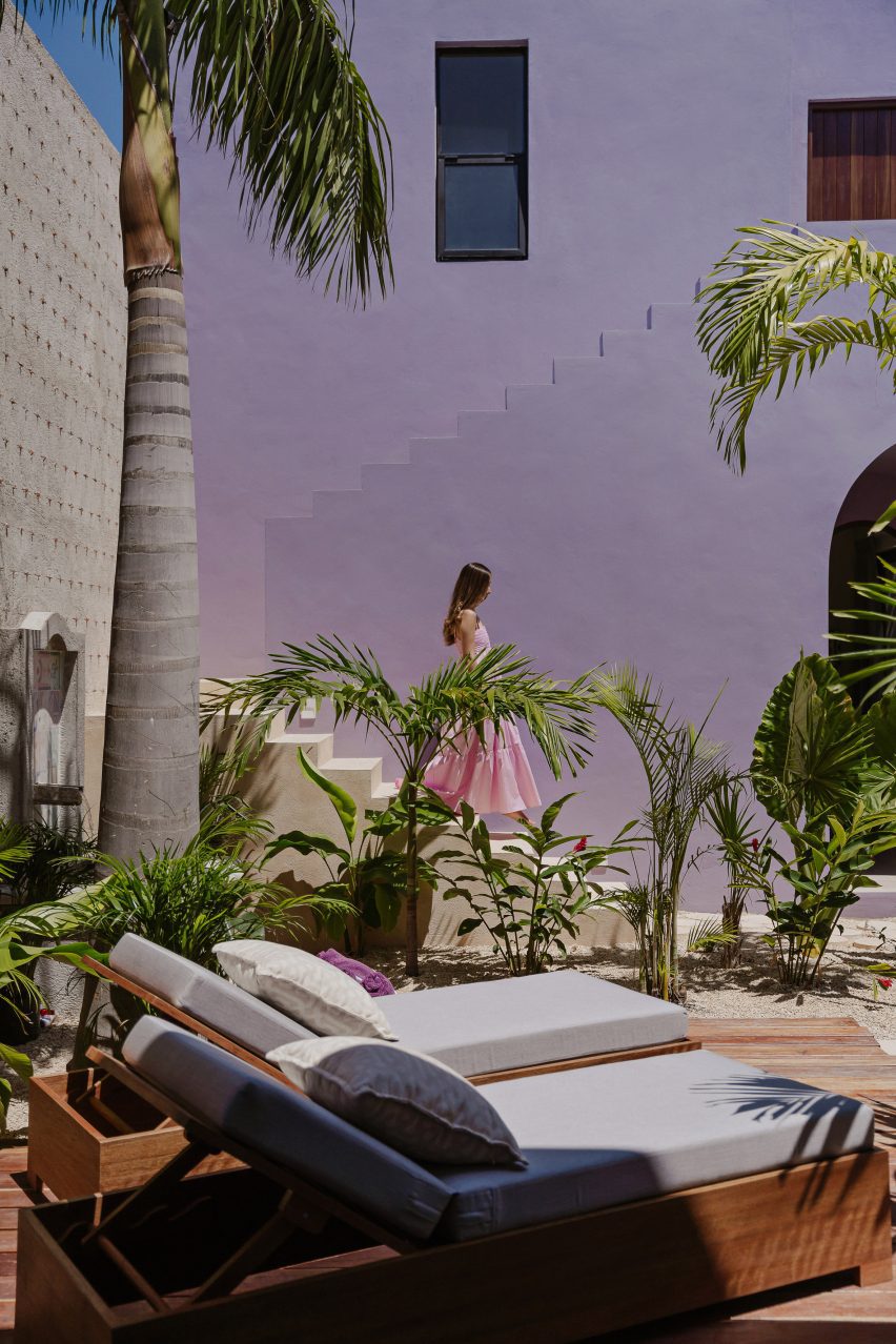 Purple Casa Pulpo building with sun loungers in front