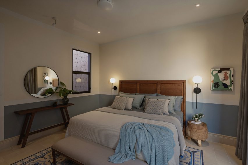 Interior of a bedroom with mosaic floor tiles at Casa Pulpo by Workshop Architects