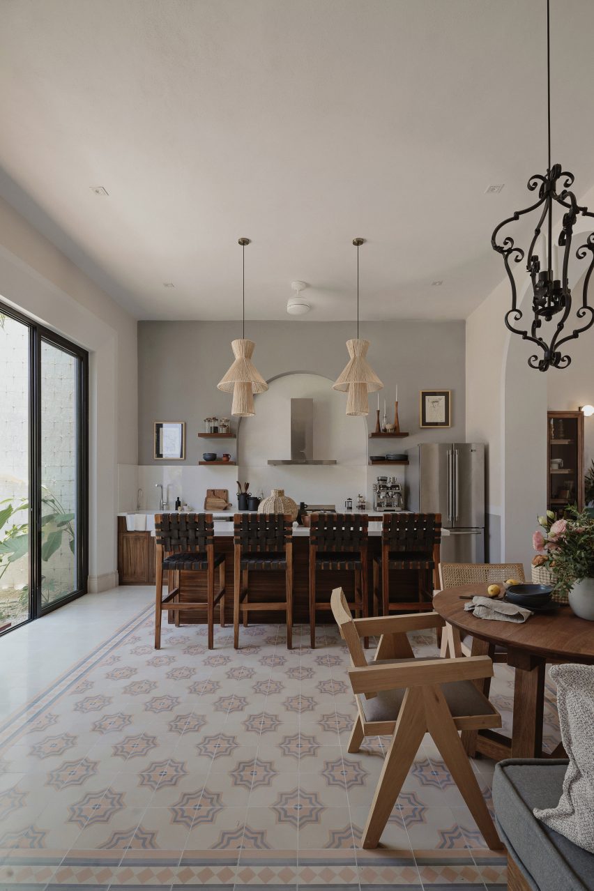 Interior kitchen with wooden kitchen island and mosaic floor tiles