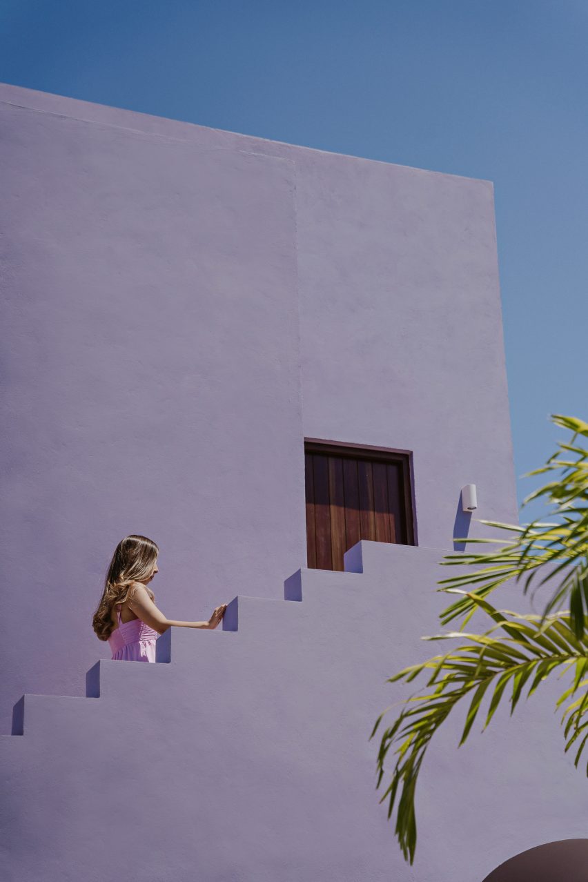 Exterior staircase at the purple Casa Pulpo by Workshop Architects