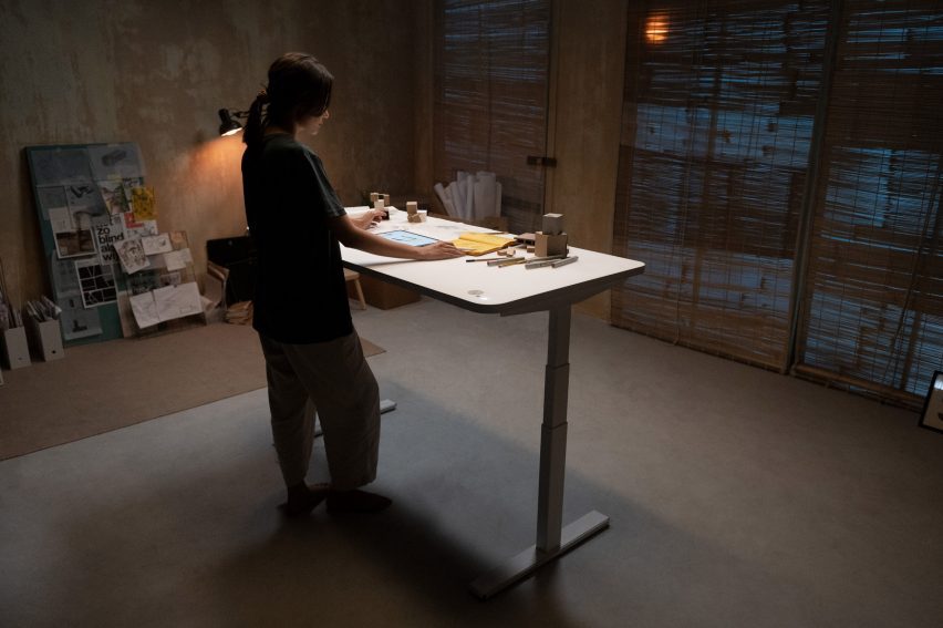 Woman working at an adjustable standing desk