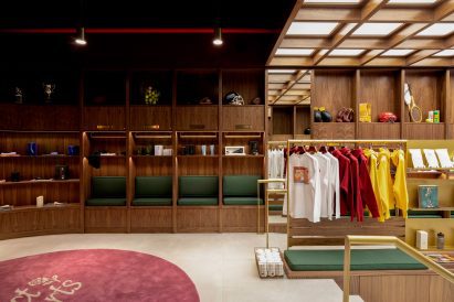Walnut panelling forms cubby holes for displaying products