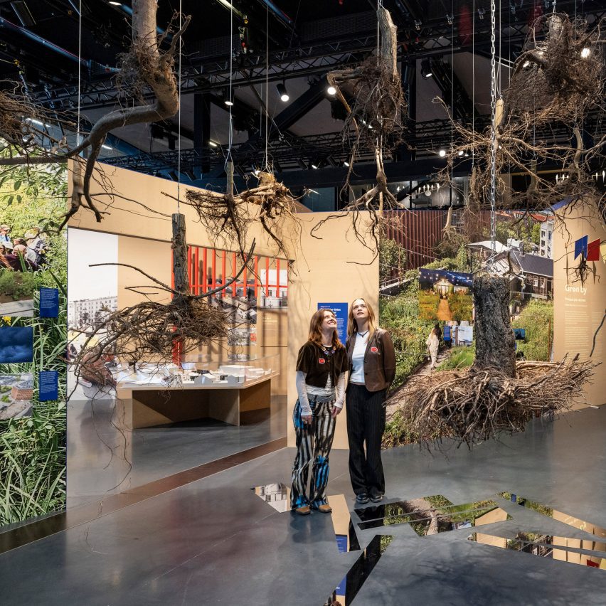 Hanging tree branches in Copenhagen in Common exhibition at Danish Architecture Centre