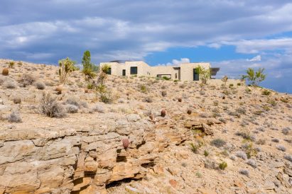Facade of stone house placed on rocky hillside of Las Vegas desert